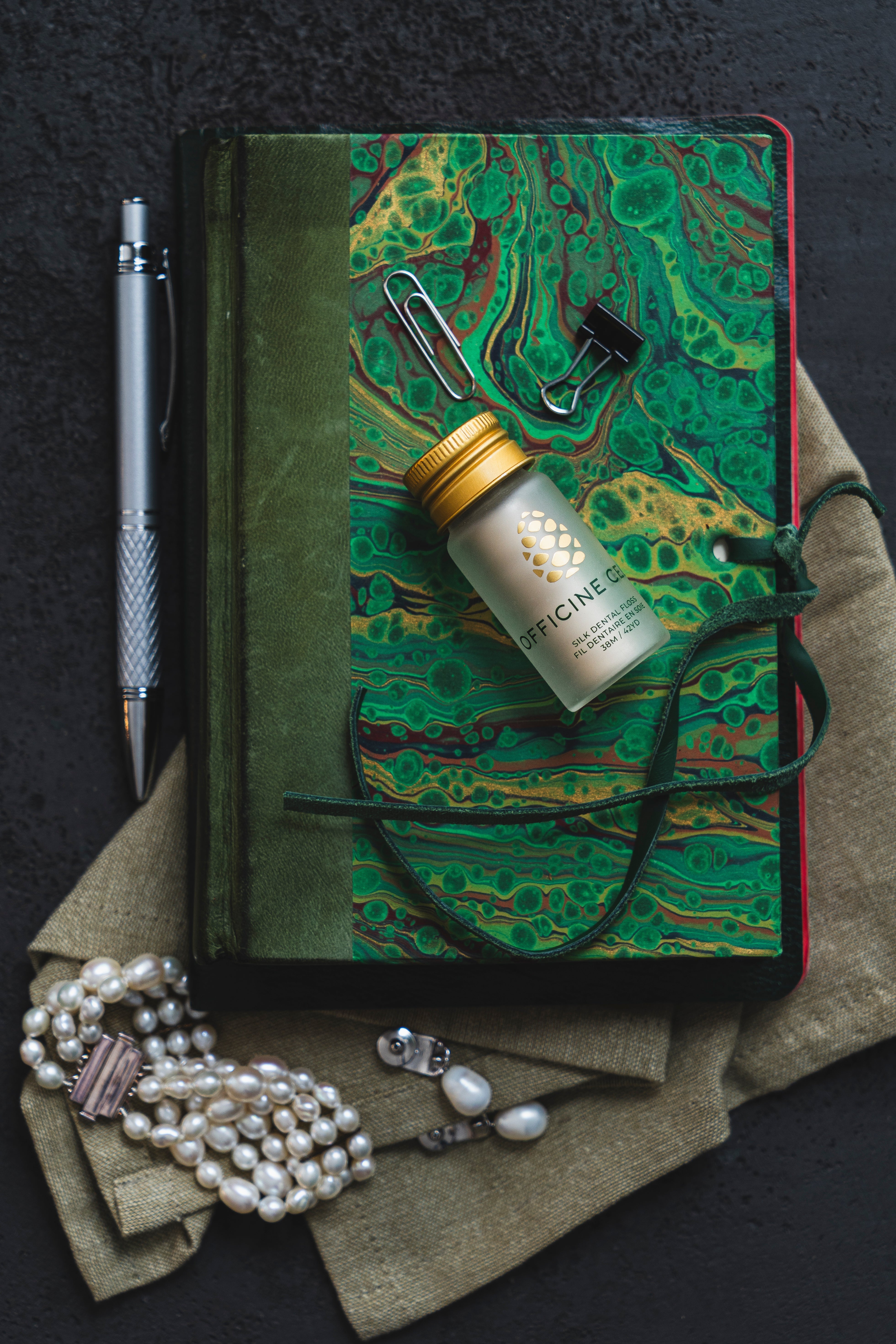 Officine Celli Silk Floss on patterned green notebook